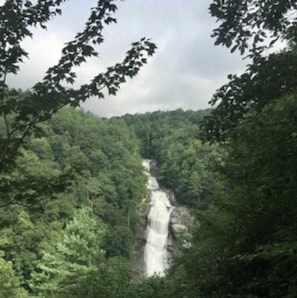 You can walk on wooden steps see and hear this waterfall, it joins more trails.
