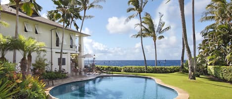 Hale A Kai at Poipu - Heated Oceanfront Swimming Pool with Large Lawn.jpg