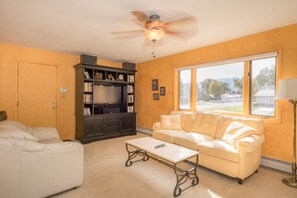 Family room with flat screen television, Bluetooth receiver and speakers