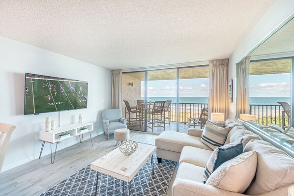 Cozy up, catch the game, or enjoy a meal—this open, beachy retreat is made for relaxing and making memories!