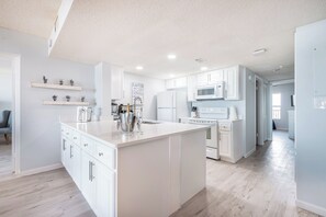 Bright, modern kitchen—cook, sip, and enjoy!