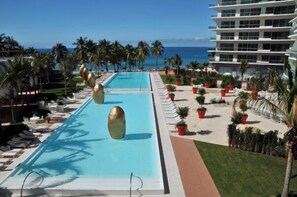 Spectacular pool deck surrounding a 500 feet infinity-edge pool.