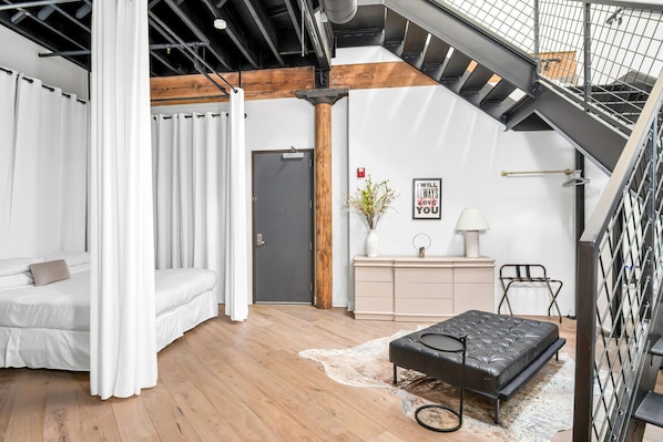 Loft entrance into the spacious bedroom with king bed