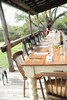 This expansive porch overlooking the lake has room for everyone to eat together.