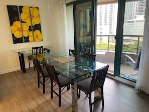 Dining area across from kitchen, table with six chairs and a small desk