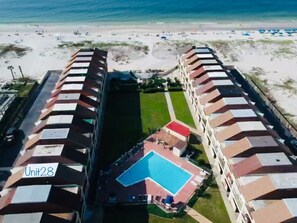 Drone view photo shows Unit 28's awesome proximity to the pool and beach.