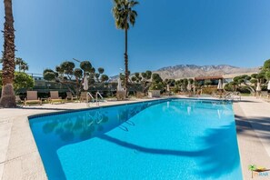 Heated Pool 1 with plenty of lounge chairs and mountain views