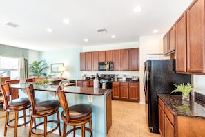 Large well equipped kitchen with breakfast bar