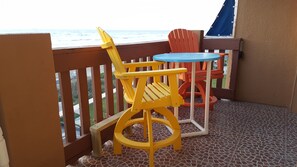 Enjoy dining at the pub height table overlooking the Gulf