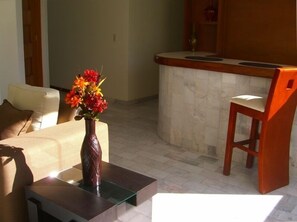 Unit 3 / feature a bar with three bar stools