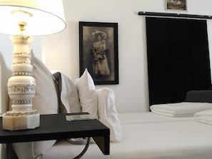The bedroom with wide twin bed and side river view