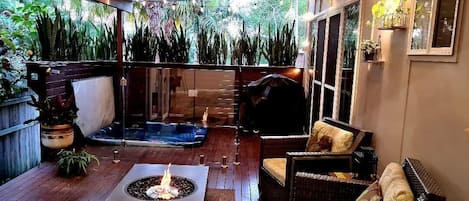 Private outdoor area with heated spa and fire table 