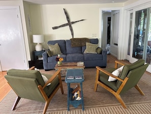 Living room - attached to screened porch and open to dining area and kitchen.