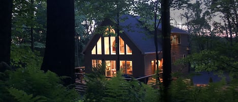 Nestled deep in the woods means total tranquility.  Relax on the over sized deck