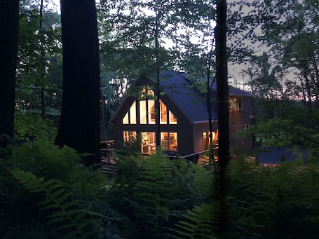 Nestled deep in the woods means total tranquility. Relax on the over sized deck