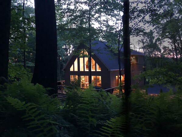 Nestled deep in the woods means total tranquility.  Relax on the over sized deck