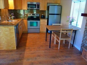 Kitchen with full compliment of appliances