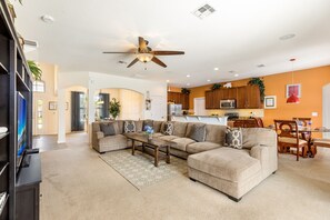 Living room open to Kitchen area, the Large sofa can seat 9 comfortable.