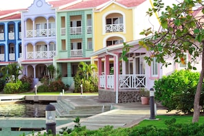 Stand-alone Pink House in the middle of condo complex.