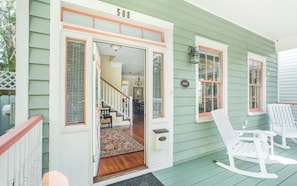 Step into your charming clapboard house.