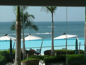 View of pool deck and ocean