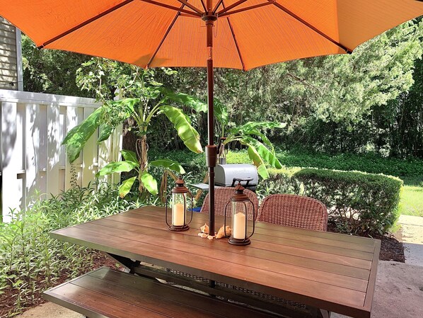 Private patio, green lawn area in front charcoal grill, charcoal honor system