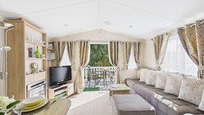  Open-plan living area with sitting and dining area. 