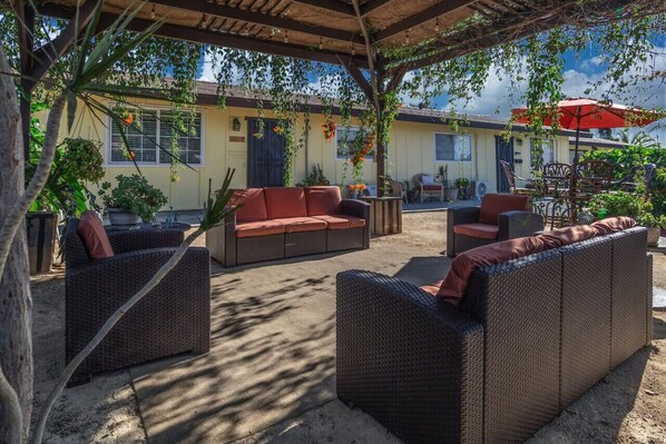 Sitting area under the pergola in the front yard
