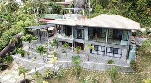 Frontview of Villa with roof deck, pavillion, terraces, and car port