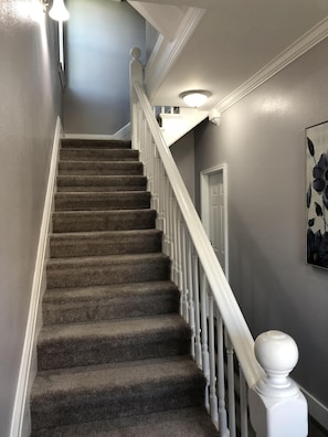 Shared entry split level hallway