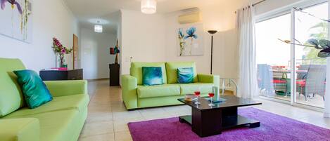 Spacious modern lounge that opens onto the large balcony