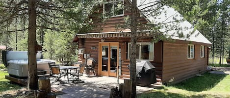 Back deck with hot tub(year round), patio set and grill.