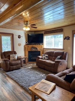 Living room with 50" smart Led tv, satellite, dvd player, wi-fi and fire place.