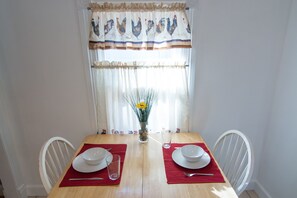 Dining table. Setting for a 3rd person in house as well.