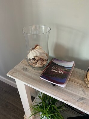 Our guest book and shell vase filled with a shell left by previous guests.