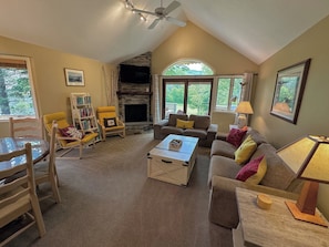 Living area with fireplace and patio