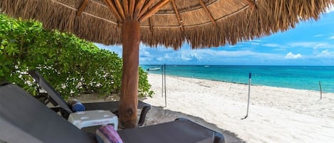 Shade palapa and loungers for guest use - Villa Serenity 3 bedroom Aventuras Akumal beach vacation rental