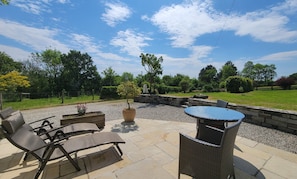 Cottage patio overlooking gardens and fields