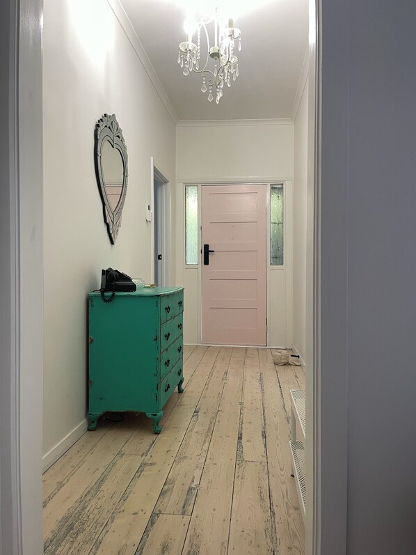 Lime washed floorboards lead the way into this special love nest.