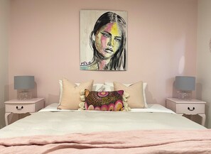 Pink bedroom - a beautiful room with garden views and king bed.
