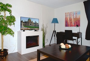 Electric fireplace, Smart TV and desk area