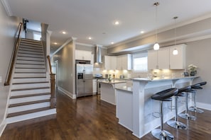 Stainless appliances and beautiful slab granite.