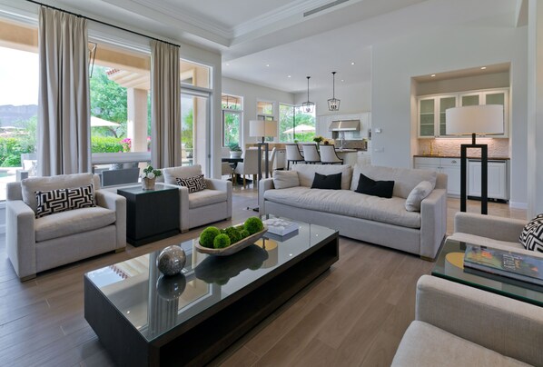 Family room with seating for 8. Wet bar with sink and mini fridge with ice maker