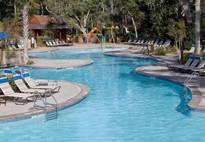 Woodsy pool with play area and waterslide.