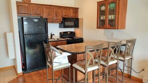Full kitchen. Dishwasher under island. High chair for child (removable)