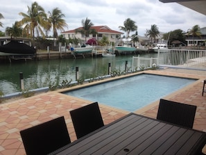 Pool with view of dock and canal