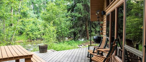 Listen to Rock Creek while enjoying the deck at Uppa Creek Cabin