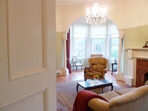 Spacious sun-filled lounge with turret overlooking a beautiful bowling green
