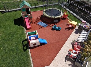 View of the playground inside the private fenced garden