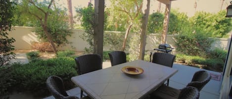 View of corner patio. Upgraded seating. Walled-in privacy.  No lookie-loos.